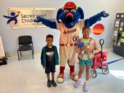 OTTO poses with kids at Providence Sacred Heart Childrens Hospital.jpeg